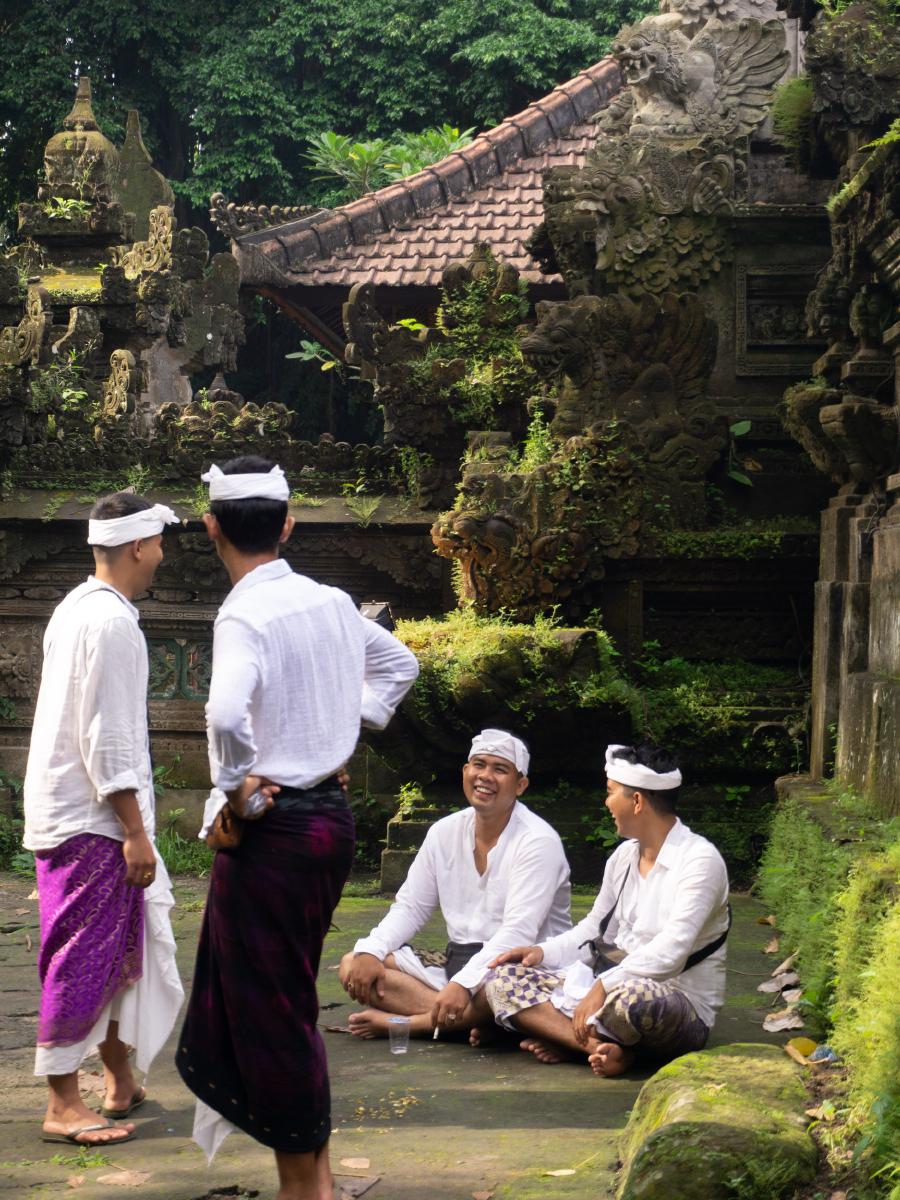 Balinese in traditional clothing next to Pura Gunug Lebah Balinese in traditional clothing next to Pura Gunug Lebah
