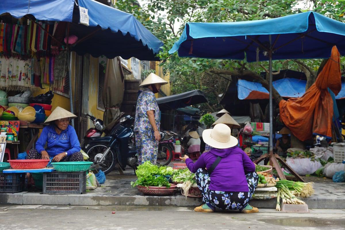 Selling vegetables just outside the market