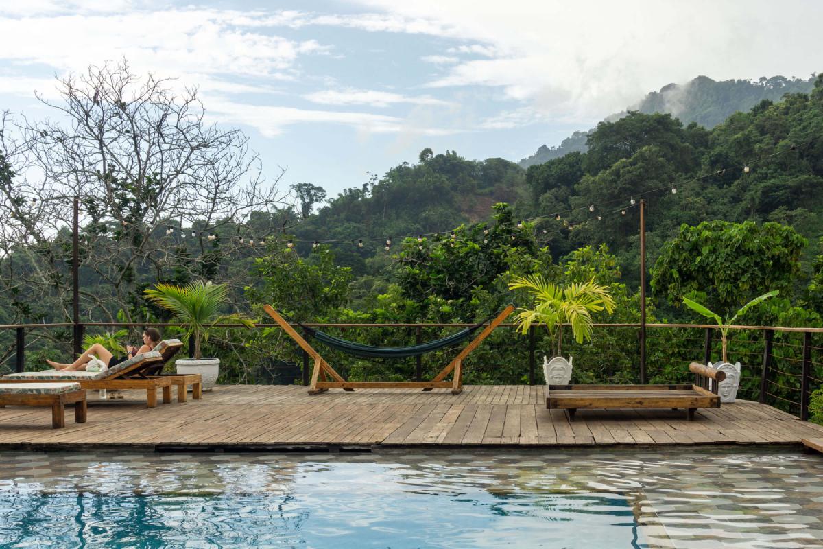 La Veranda Hotel Deck and Pool, sun chairs, hammock, and a view of Minca’s mountains La Veranda Hotel Deck and Pool, sun chairs, hammock, and a view of Minca’s mountains
