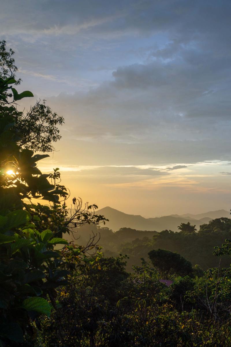 Sunset over the mountains of Minca, with Santa Marta city in the distance Sunset over the mountains of Minca, with Santa Marta city in the distance